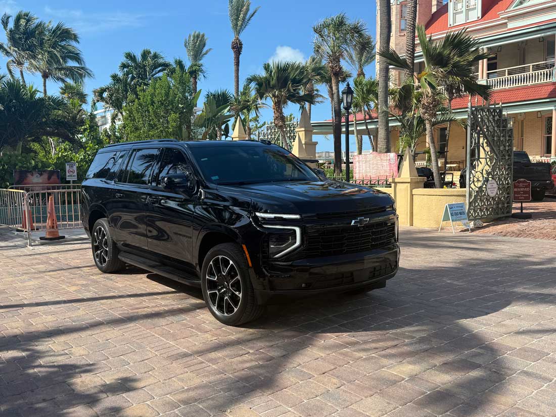 Professional Florida Keys transportation vehicle near palm trees